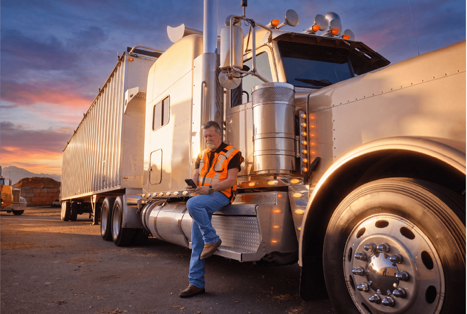 man outside of truck using device for shipments
